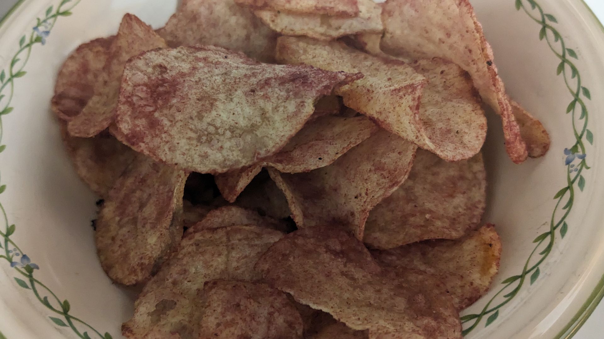 A bowl of ketchup potato chips