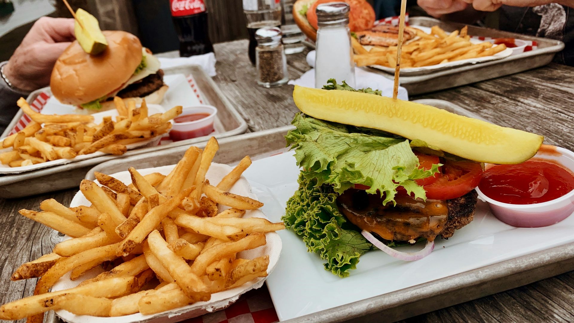 potato fries near burger with cabbage beside ketchup