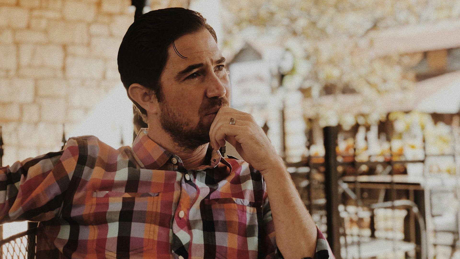 man in red and black plaid dress shirt