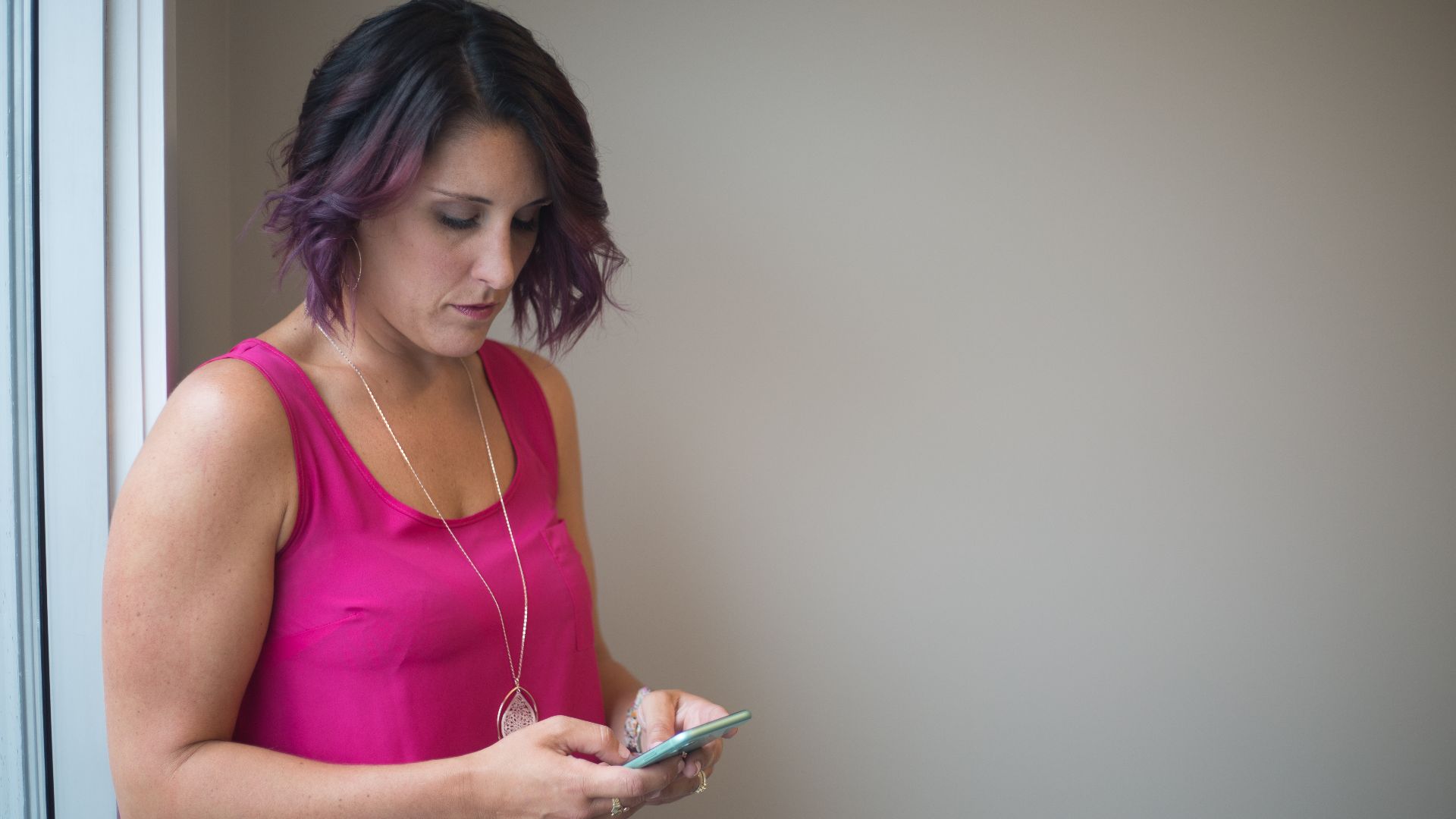 Woman texting on a smartphone
