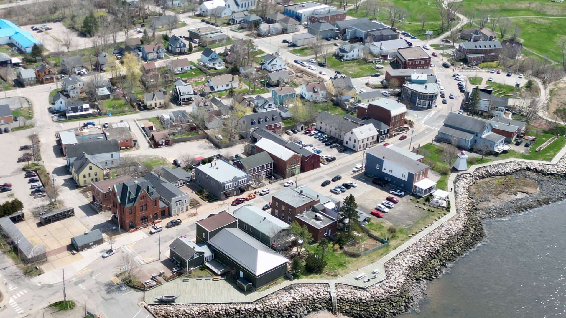 Drone shot of the waterfront of Annapolis Royal, NS looking at down on St George Street with Fort Anne in the background.