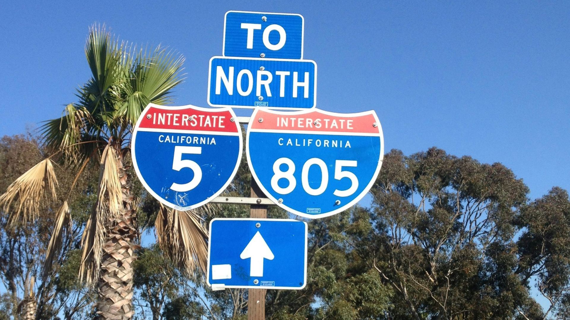 blue and white stop sign
