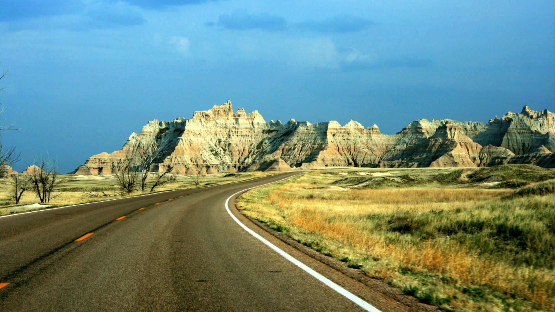 brown mountains near road during daytime