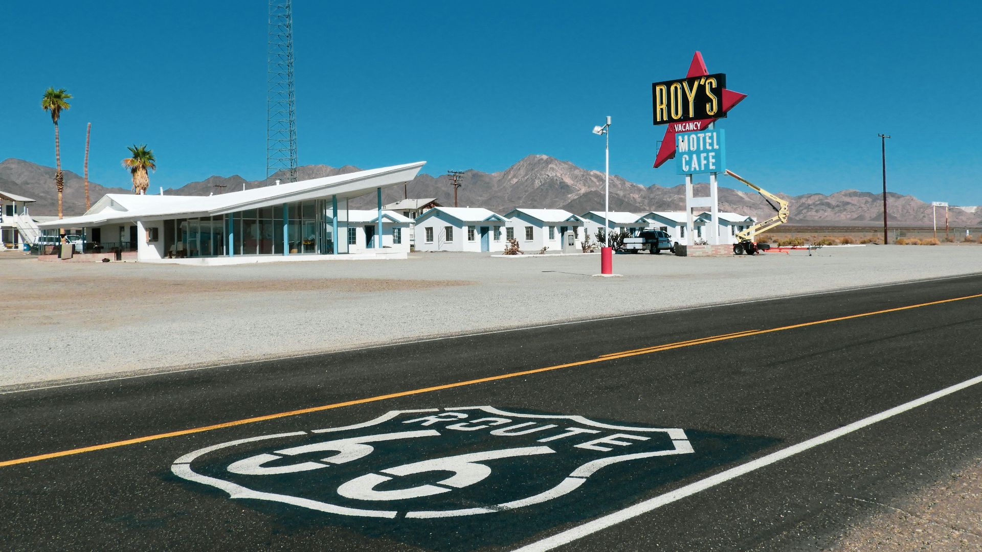 a route 66 sign on the side of a road