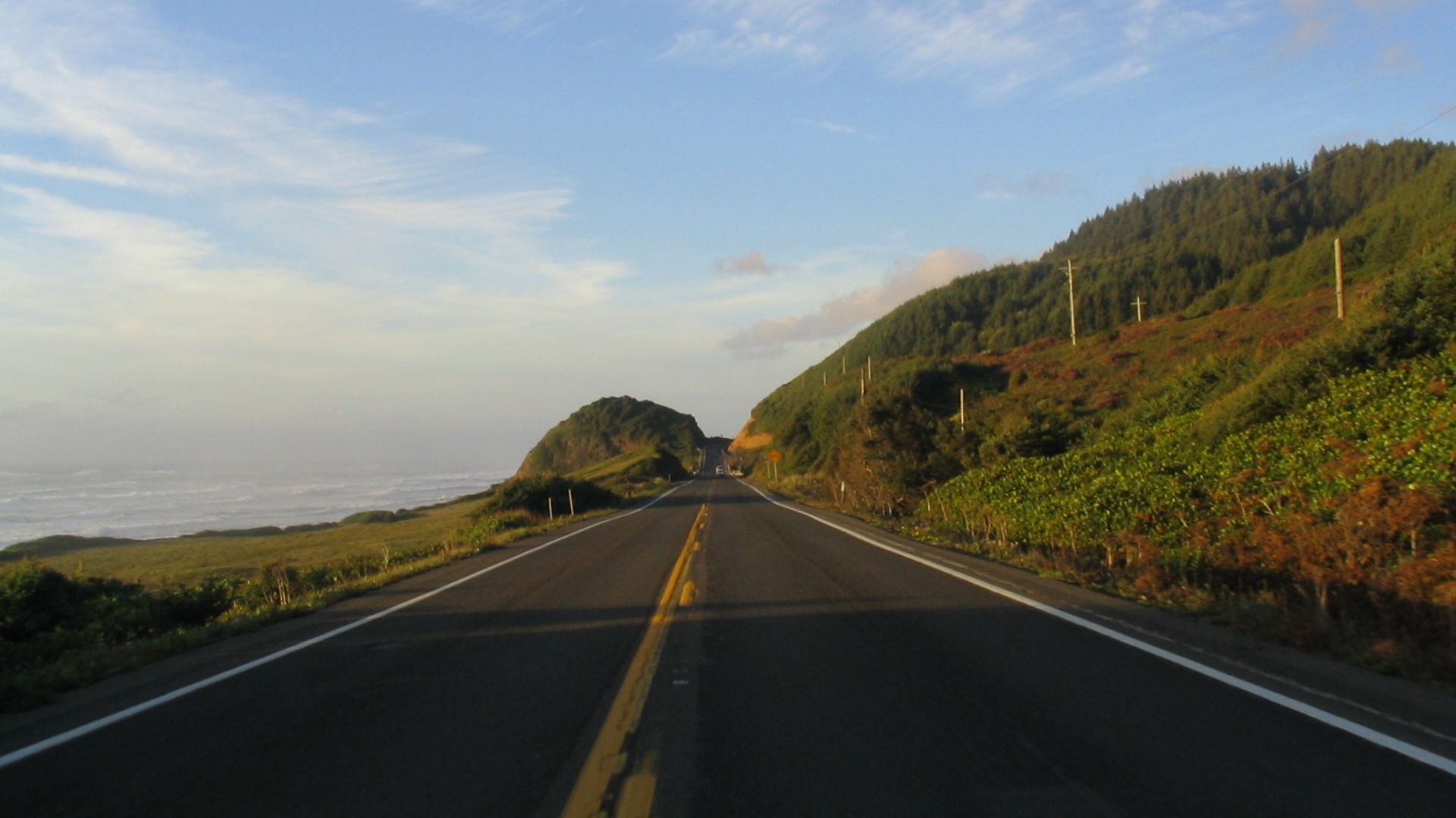 Scope and content:  The original finding aid described this photograph as:
Original Caption: The Pacific Coast Scenic Byway in Oregon combines a drive along the beach with a drive through the forest. The byway is bordered by the Pacific Ocean to the west 