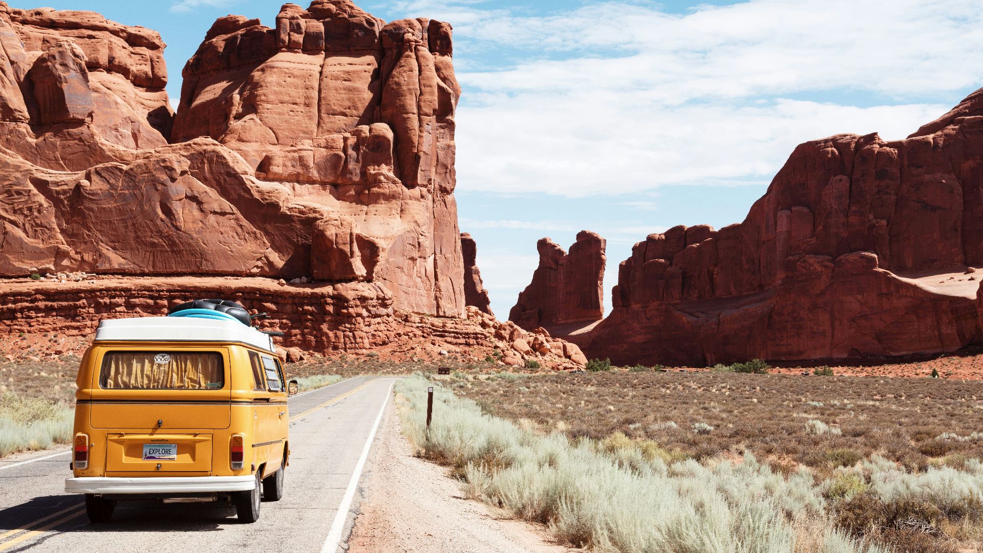 yellow Volkswagen van on road