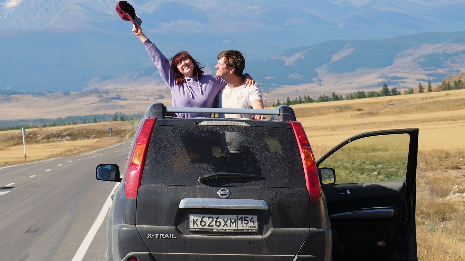 A couple of people that are in the back of a truck