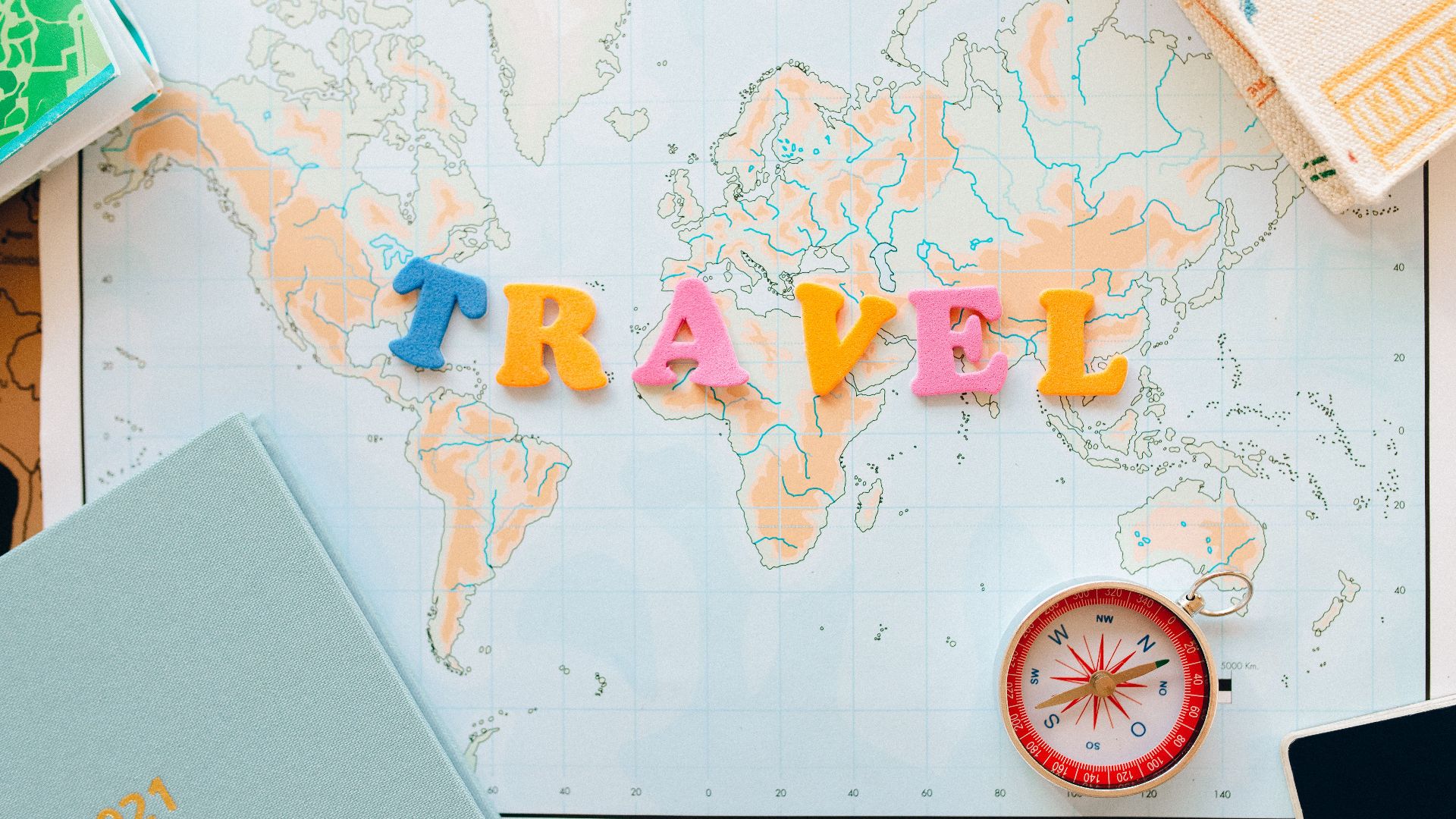 Flat lay of a map with colorful letters