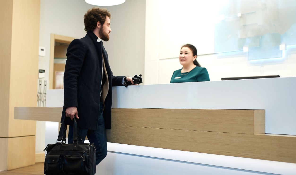Shutterstock-1668207475, young handsome businessman in fashion coat, casual clothes wants to stay in the luxury hotel