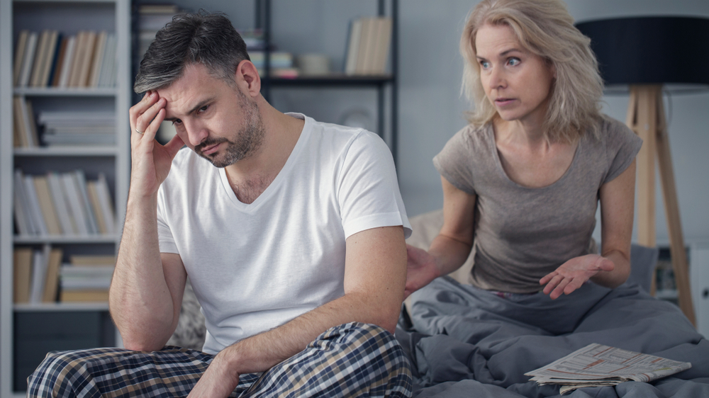 Married couple arguing in bedroom