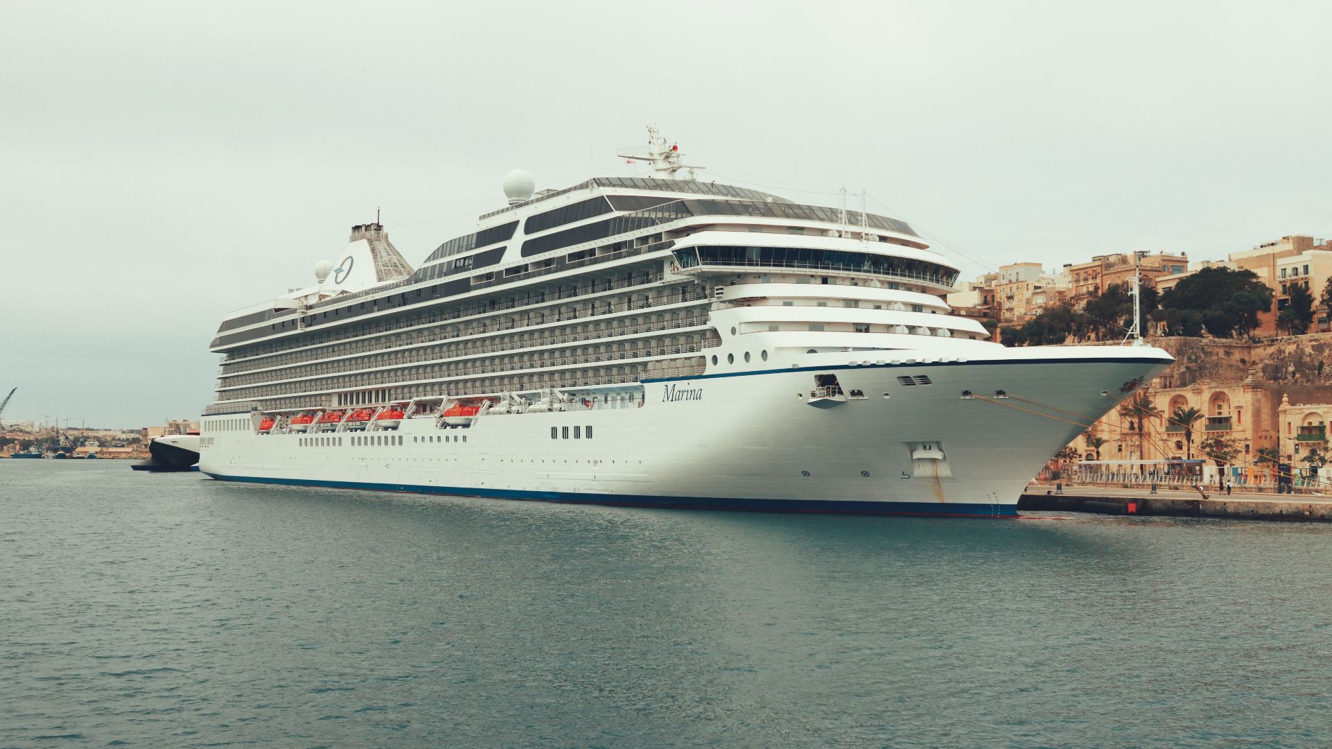 A luxurious cruise ship, MS Marina, moored in Valletta, Malta's scenic harbor.