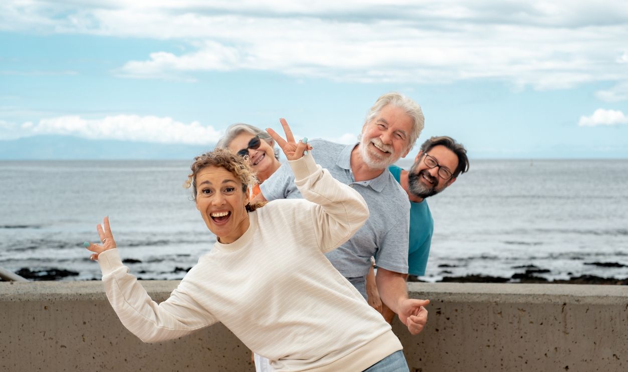 Shutterstock-2320704477, Happy Multi generation family in sea vacation have fun together in outdoor smiling carefree. Old parents, mature son and daughter-in-law