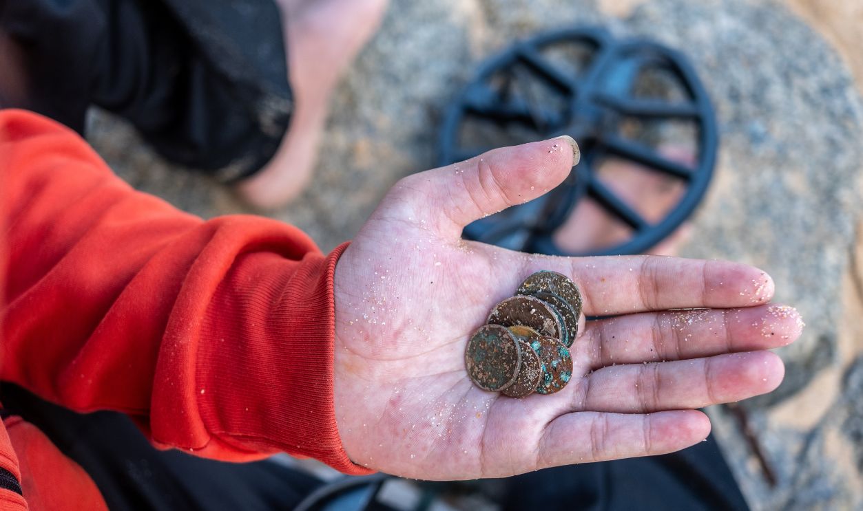 Treasure hunters use metal sensing tools until they find valuable items such as antique coins, watches.