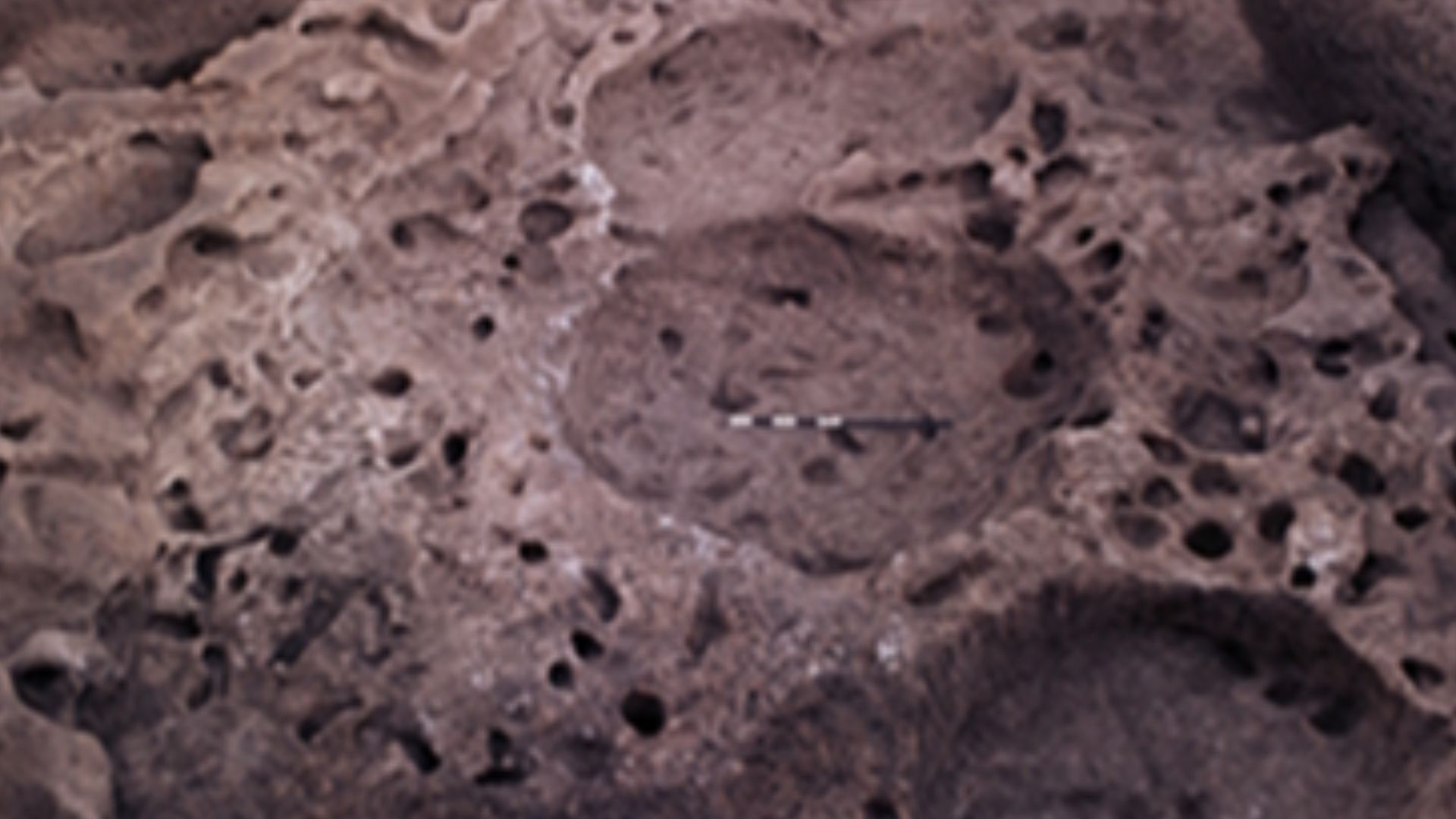 Superimposed structures within Trench E showing Neolithic 2A (10,600-9,300 cal BP) rectilinear structure atop Epipalaeolithic 1A  (13,300-12,800 cal BP) pit dwellings in the foreground. Abu Hureyra, Syria