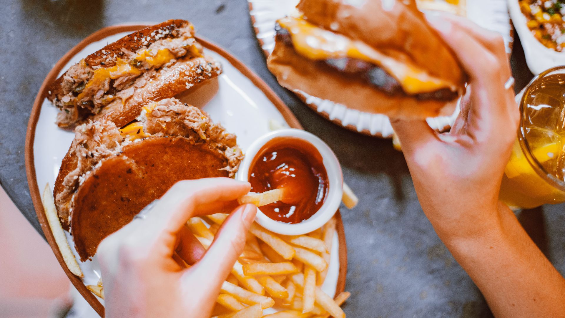 Mouth-watering fast food meal featuring burgers, fries, and refreshing drinks.