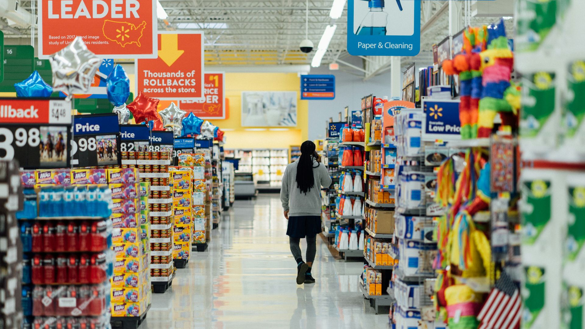 person standing between shelvings