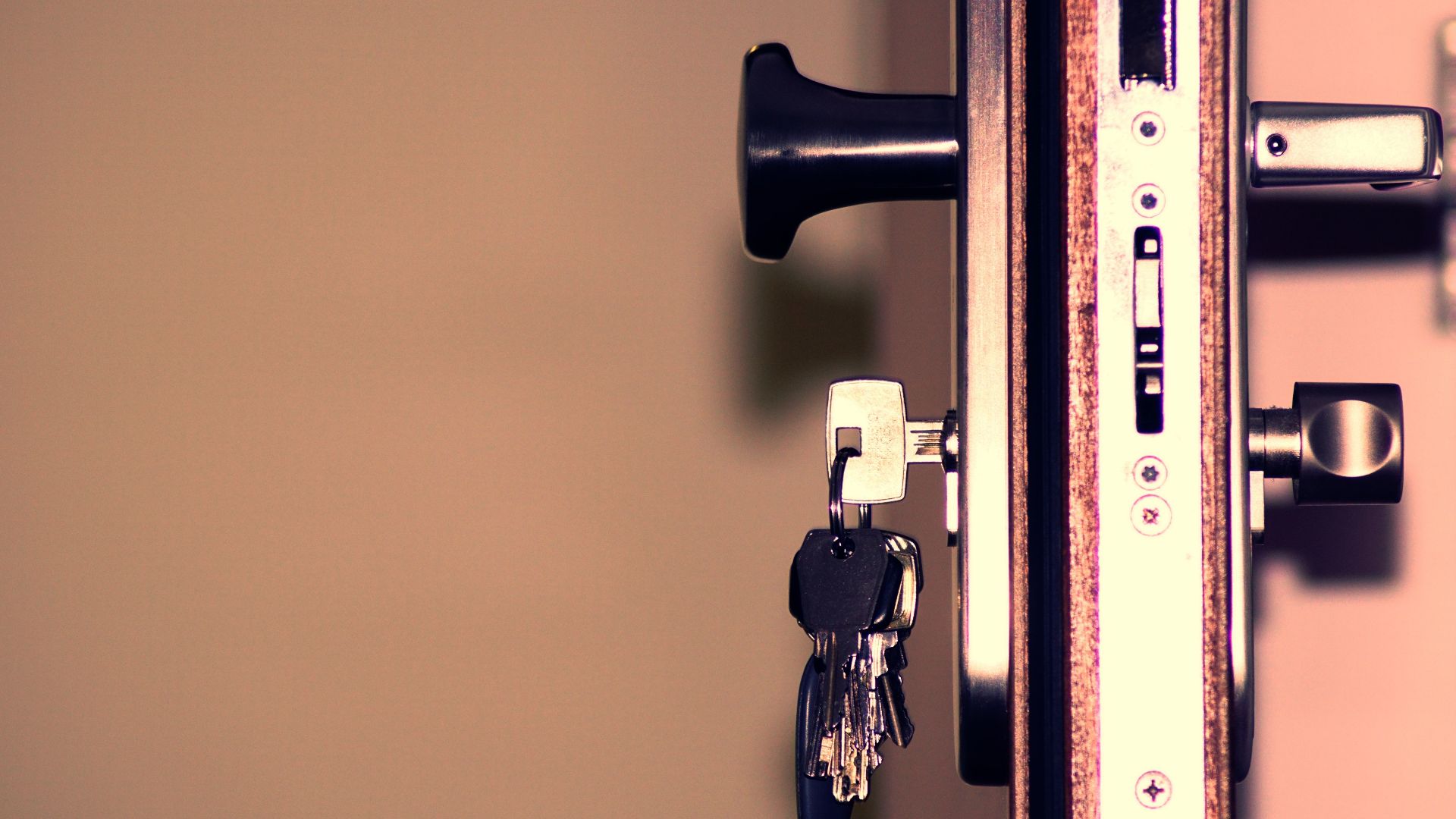 Detailed view of a door lock and keys emphasizing security and access.