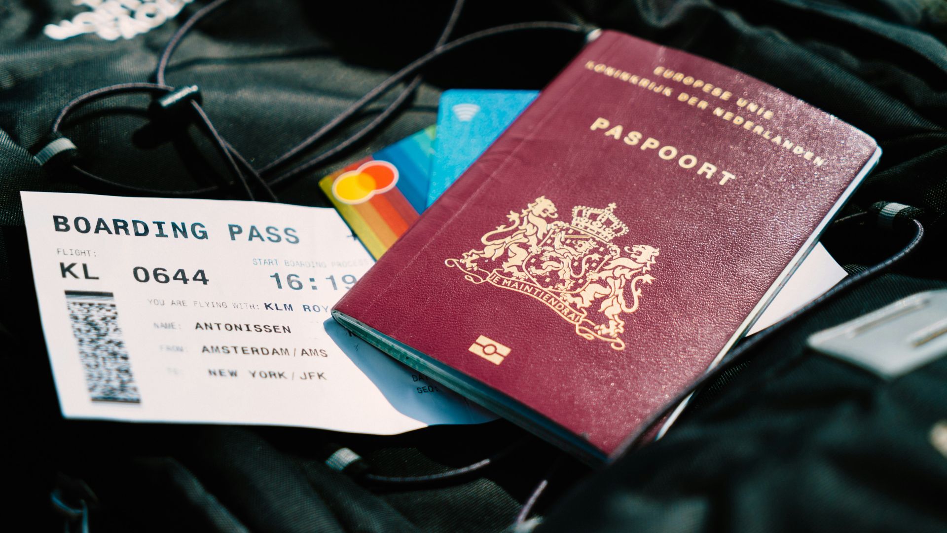 a passport and a boarding pass are on a bag