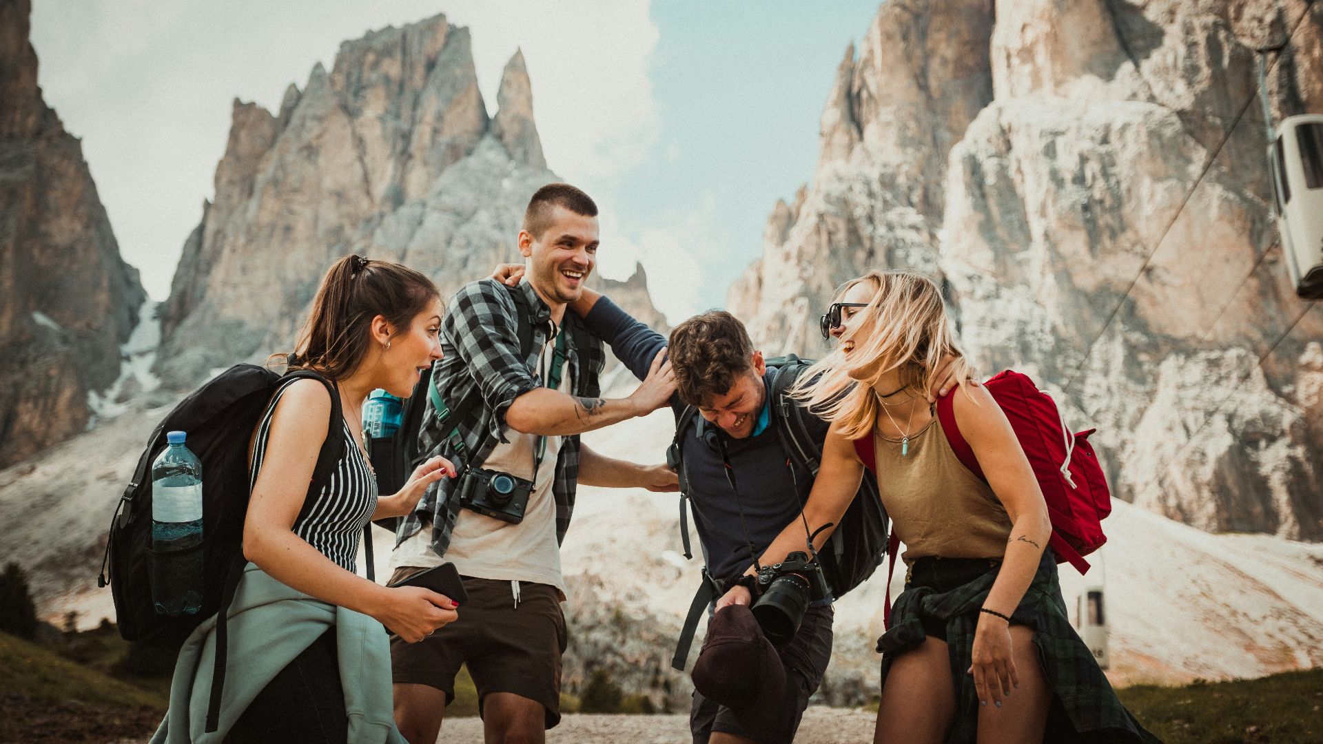 low-angle photography of two men playing beside two women