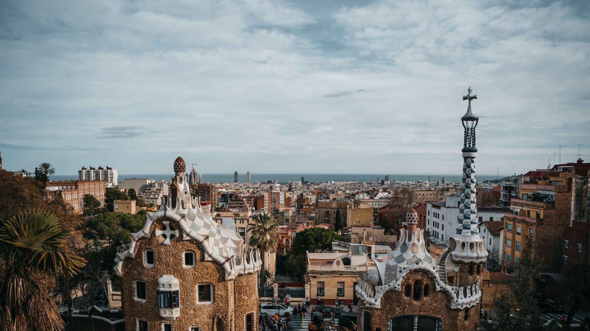 Scenic view of Park Güell's unique architecture overlooking Barcelona's cityscape.
