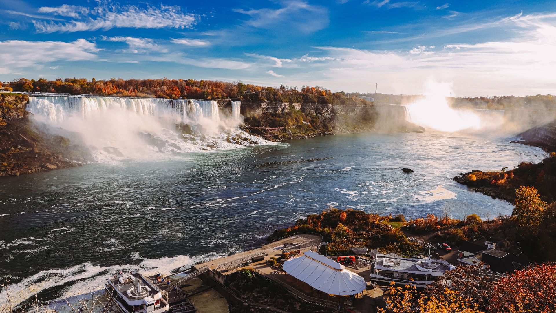 Capture the breathtaking beauty of Niagara Falls with vibrant autumn colors and cascading waterfalls.