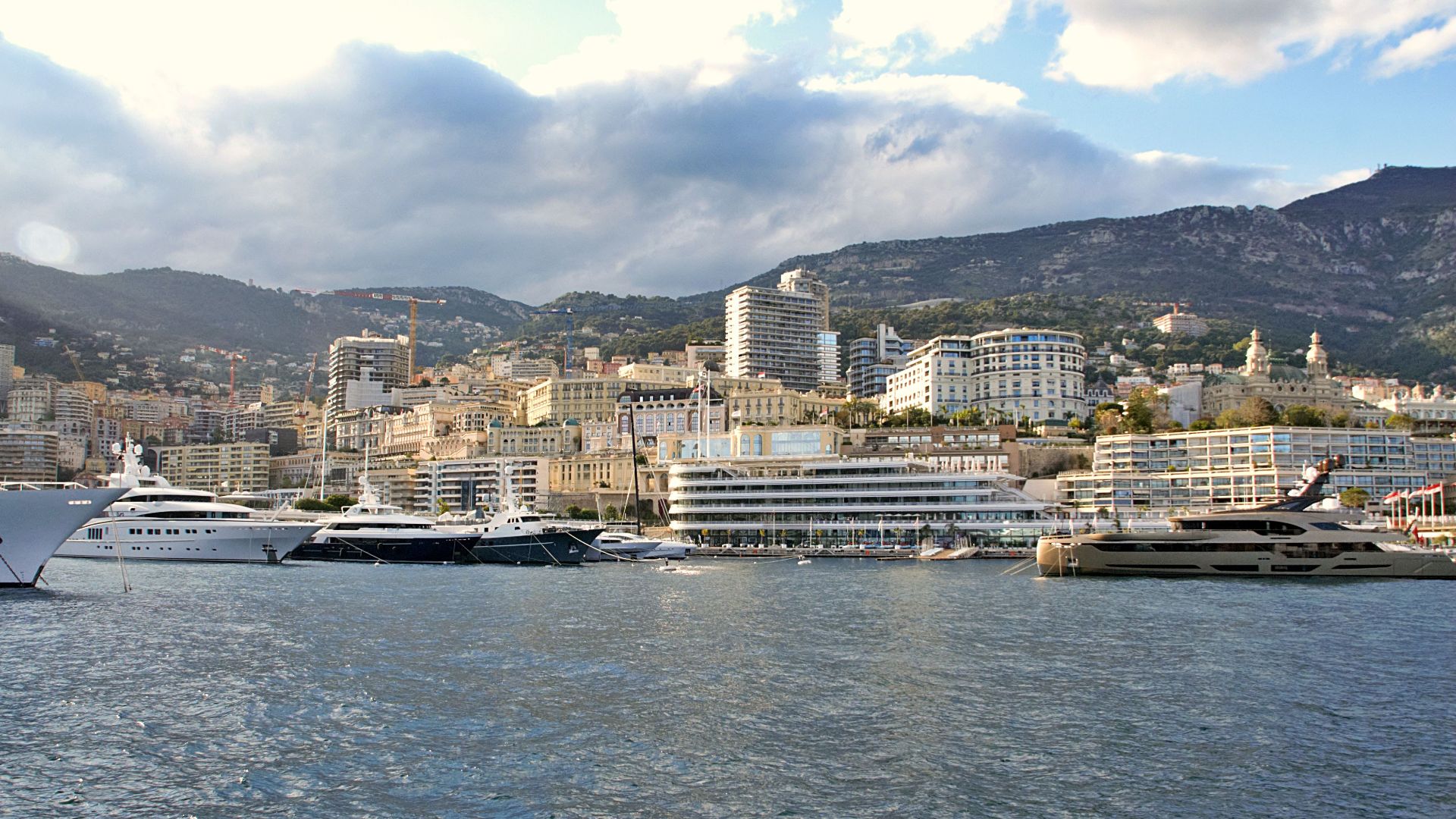 Explore the breathtaking skyline and luxury yachts at Monaco's picturesque harbor.