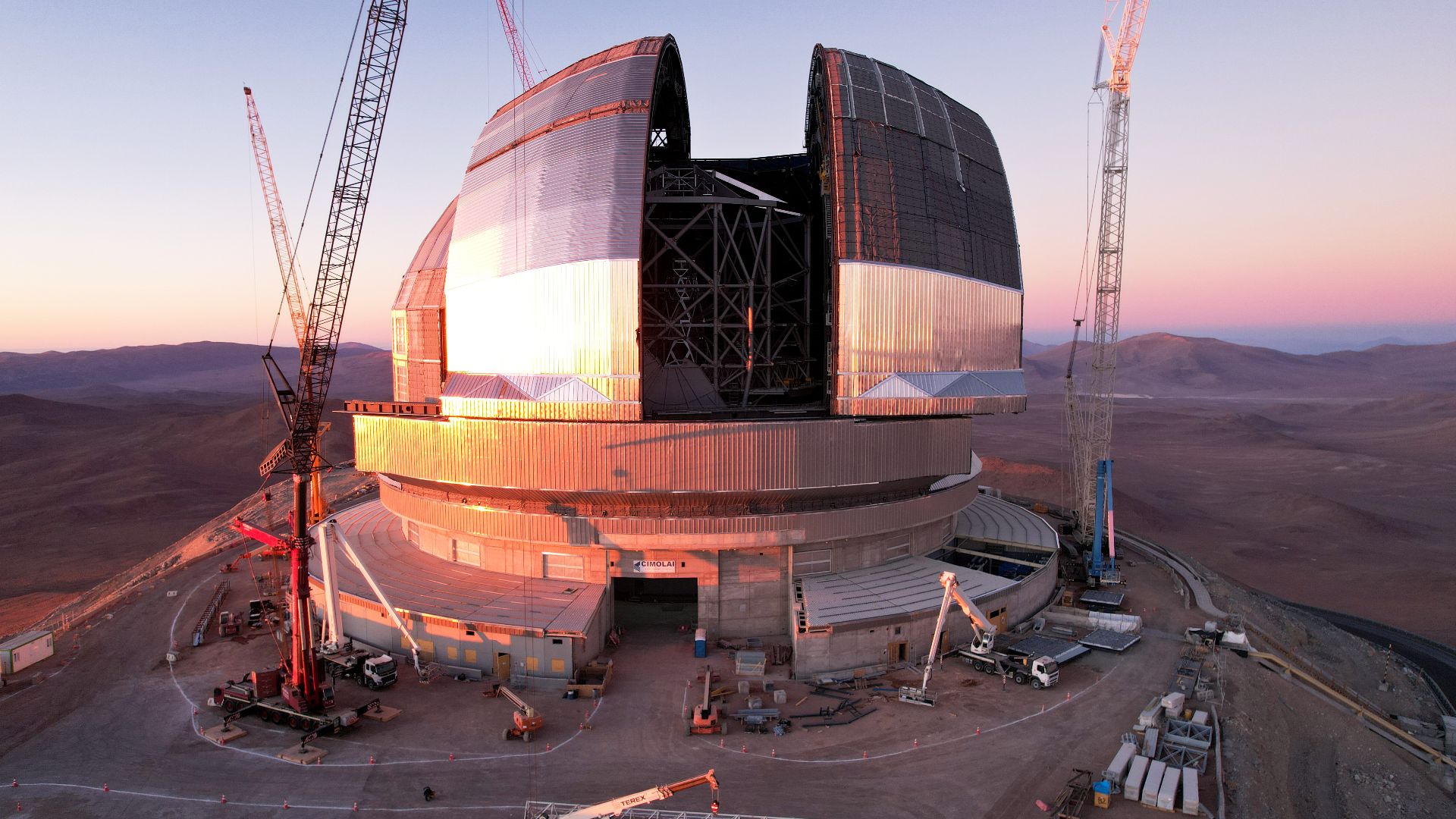 This drone shot of ESO's Extremely Large Telescope (ELT), taken in November 2025, shows the achievement of a key step in its construction: the movement of the giant doors intended to guard the telescope within. The operation of these doors must be tested 