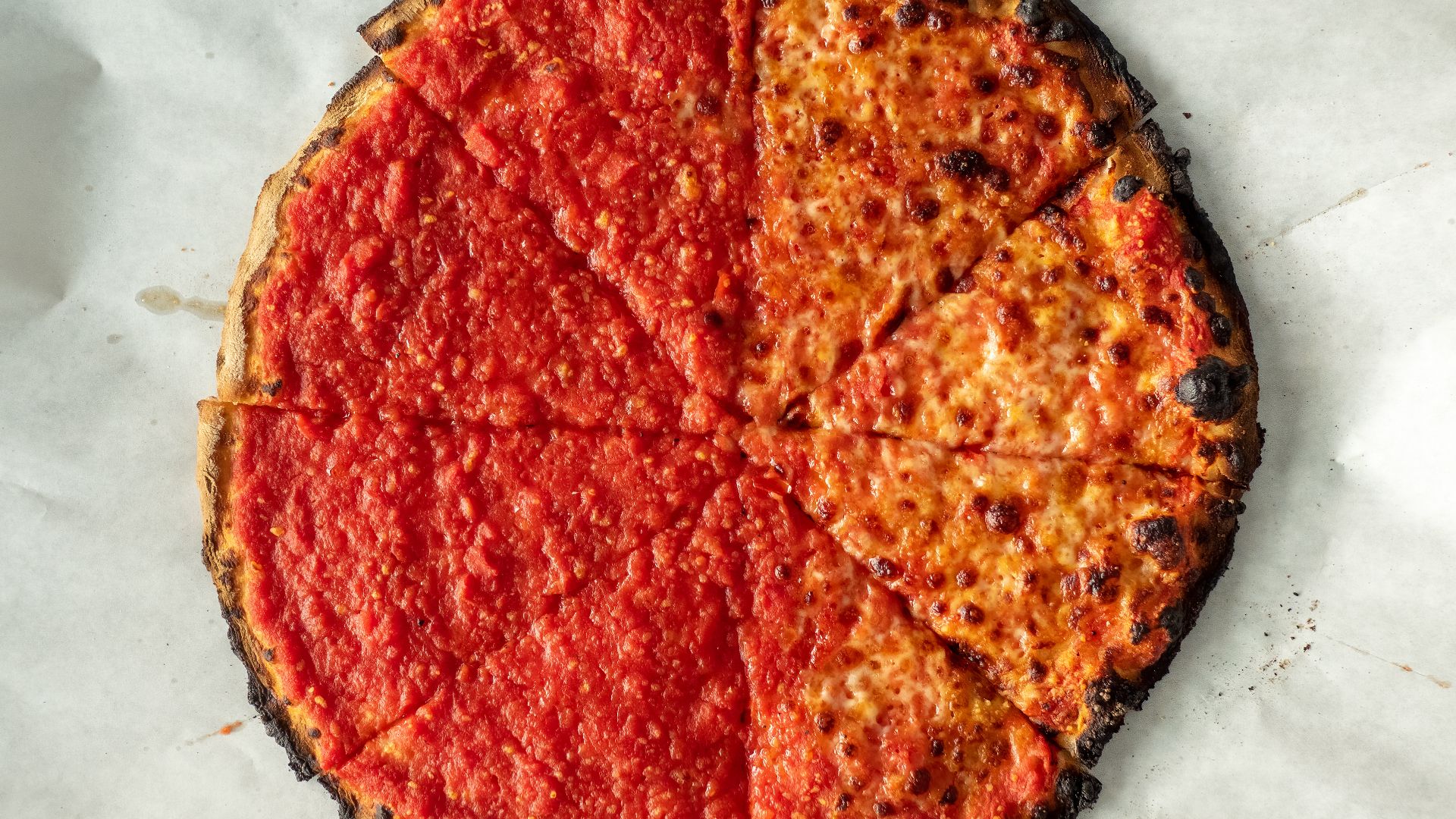 Sally's apizza half tomato half with cheese