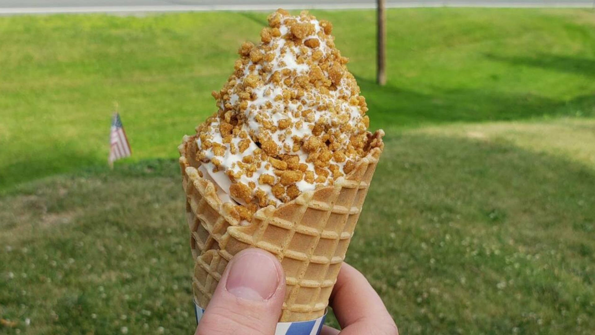 The hand of a man holding a soft-serve ice cream is known in the state of Vermont as a