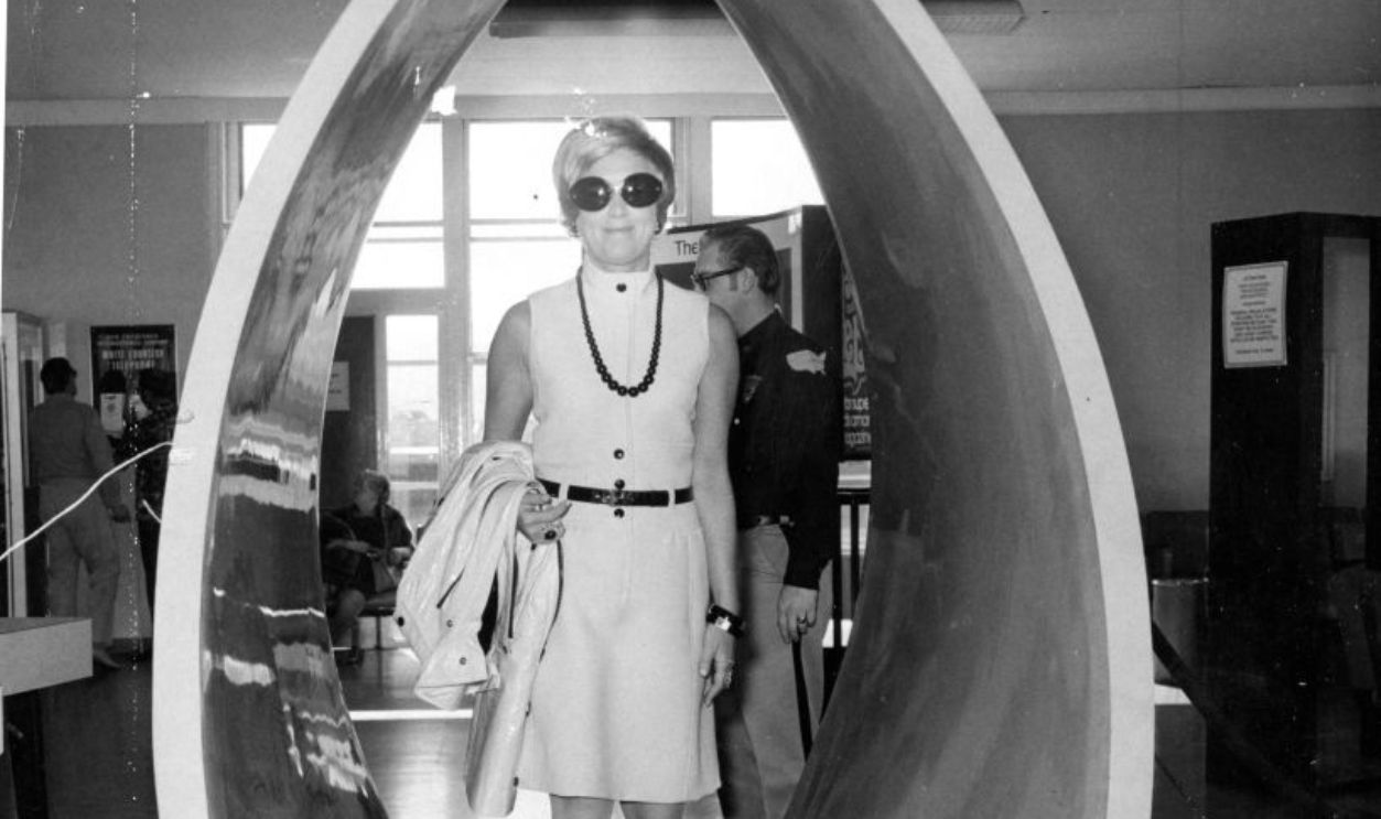  Mrs. Donald Pritzker goes through a security check at San Francisco International Airport
