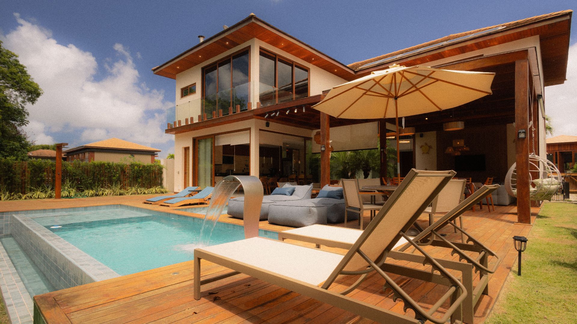 Elegant villa featuring a private pool and sun loungers for ultimate relaxation.