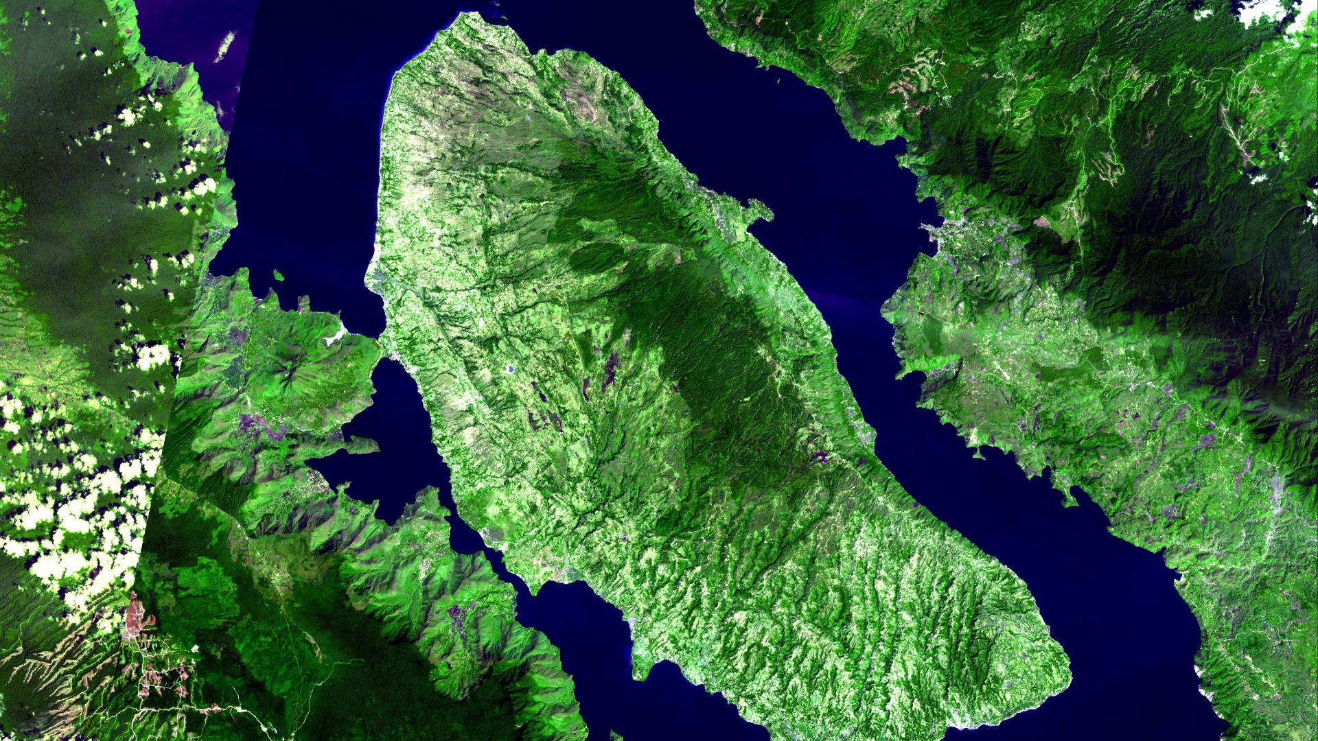Toba caldera in Sumatra, Indonesia produced the largest volcanic eruption in the last 2 million years. The caldera is 30 by 100 km, and has a total relief of 1700 m. The caldera probably formed in stages: large eruptions occurred 840,000, 700,000 and 75,0