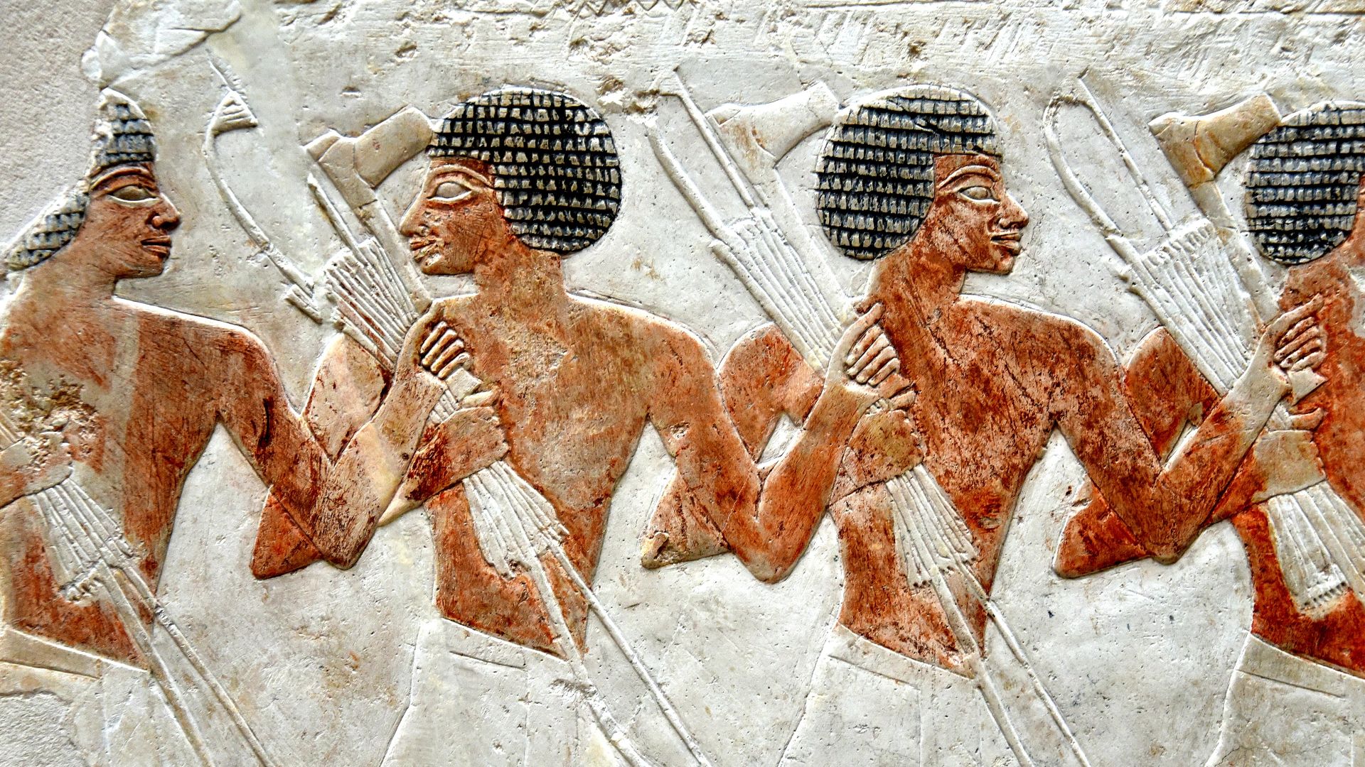 A procession of Egyptian soldiers in a festival. They hold axes, bows, and quivers of arrows. From the mortuary temple of Queen Hatshepsut at Deir el-Bahari, Western Thebes, Egypt. New Kingdom, 18th Dynasty, c. 1470 BCE. Neues Museum, Berlin, Germany. Lim
