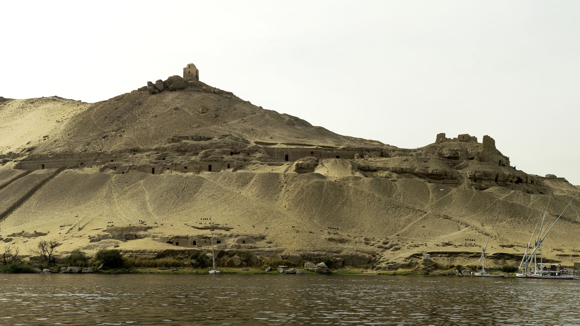 File:Aswan left bank of Nile with tombs.jpg