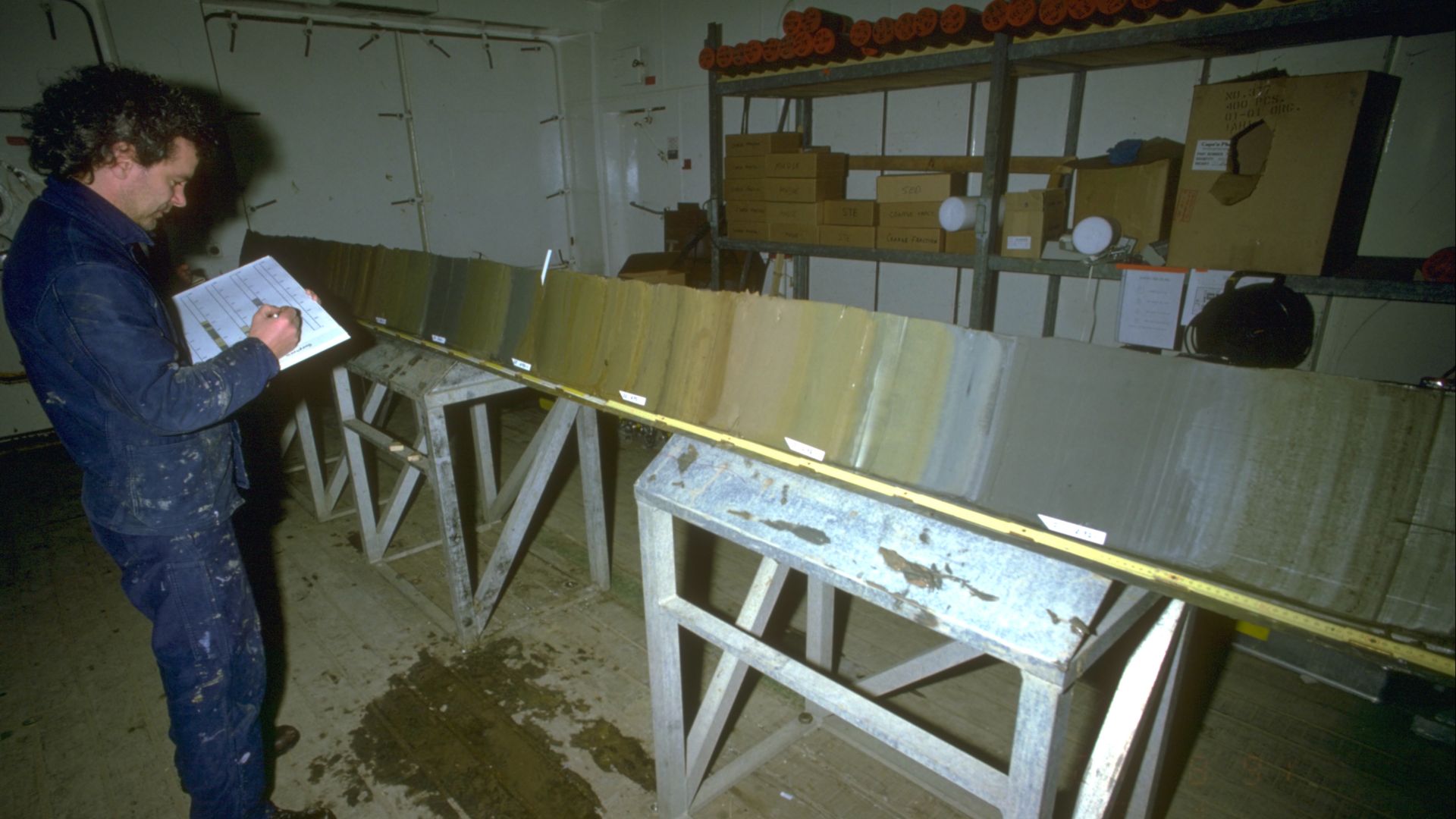 Palaeoclimate archives: 

Sediment core described by a scientist in a lab of the research vessel POLARSTERN