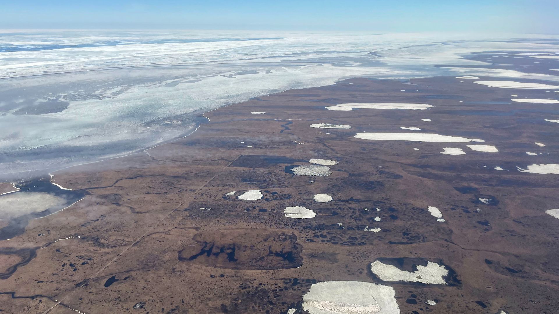 Aerial view of tundra and thaw lakes south of Utqiaġvik, Alaska.