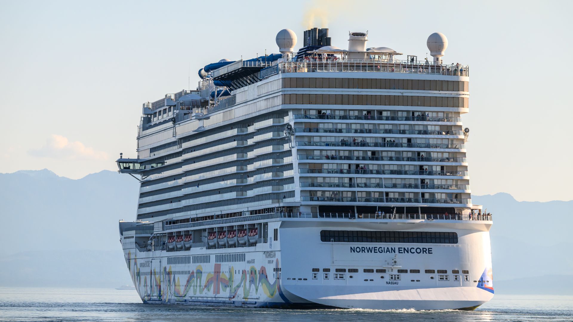 Norwegian Cruise Lines ship, NORWEGIAN ENCORE - IMO 9751511, MMSI 311000879; leaving Victoria BC Canada at sunset on May 2, 2026.