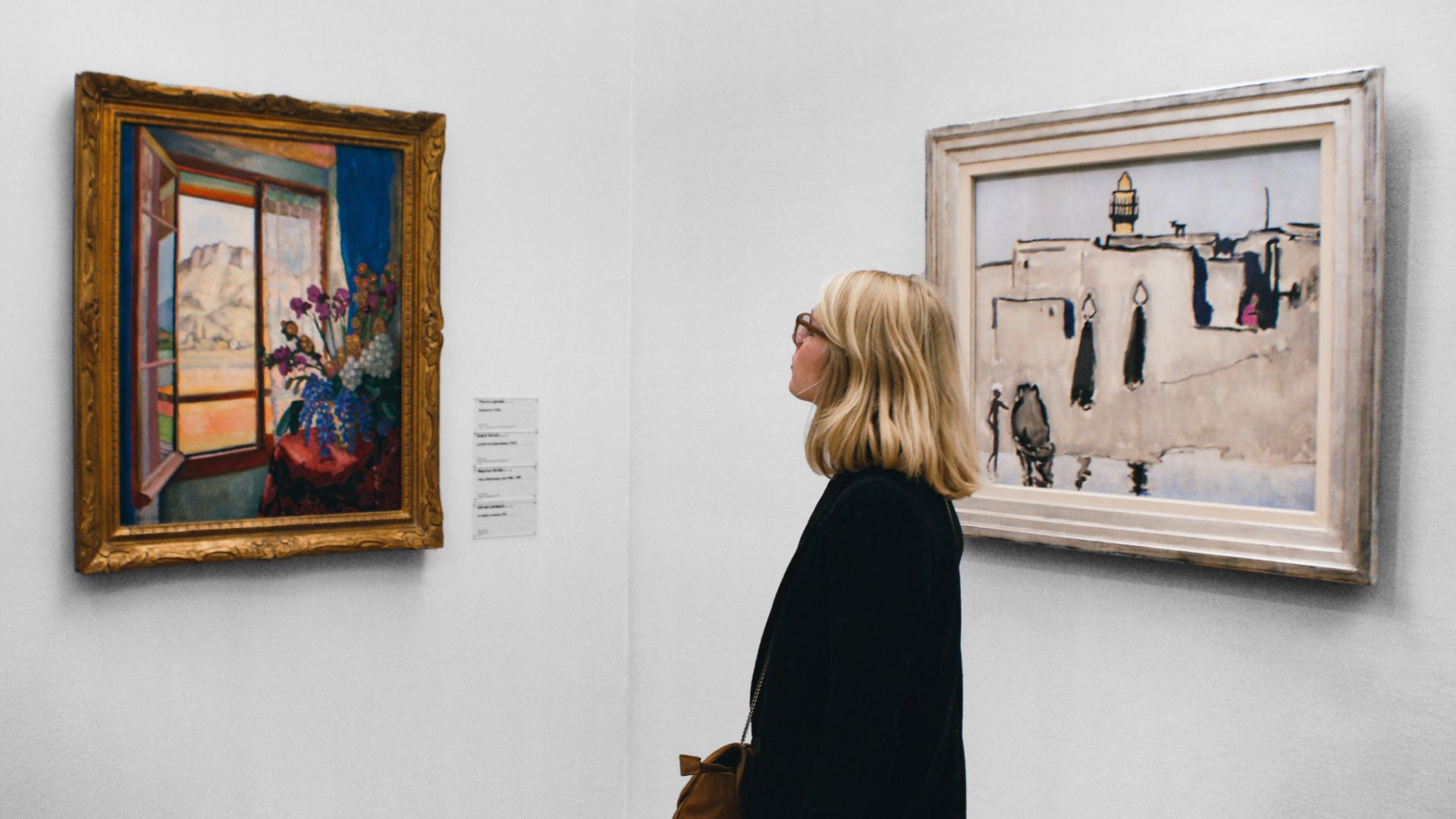 woman looking at painting