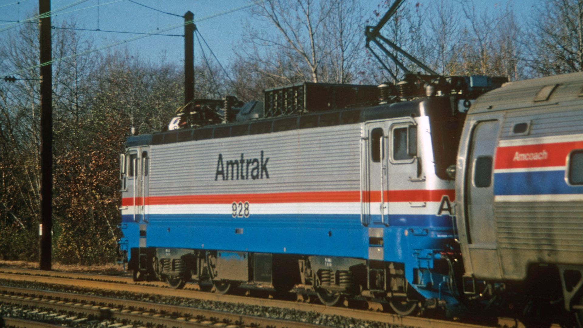Amtrak train passing through West Windsor Township, New Jersey on a clear day.