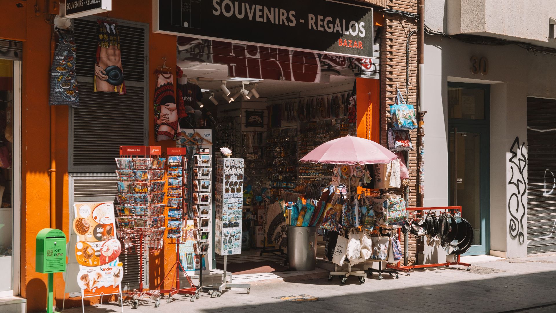 A vibrant souvenir shop in the streets of Valencia, offering gifts and local merchandise.