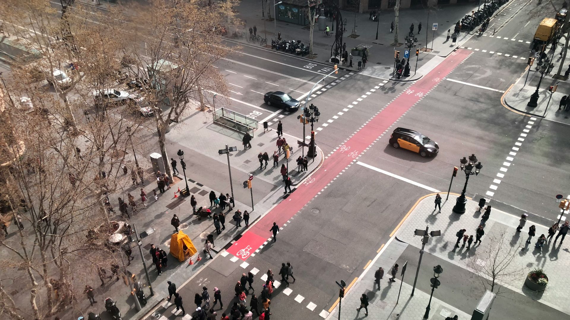 a high angle view of people crossing a street