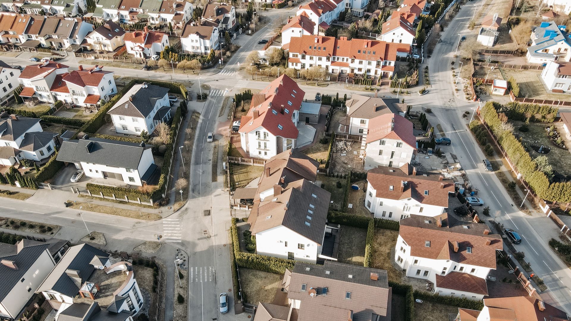 Aerial view of a suburban neighborhood with charming houses and clean streets.