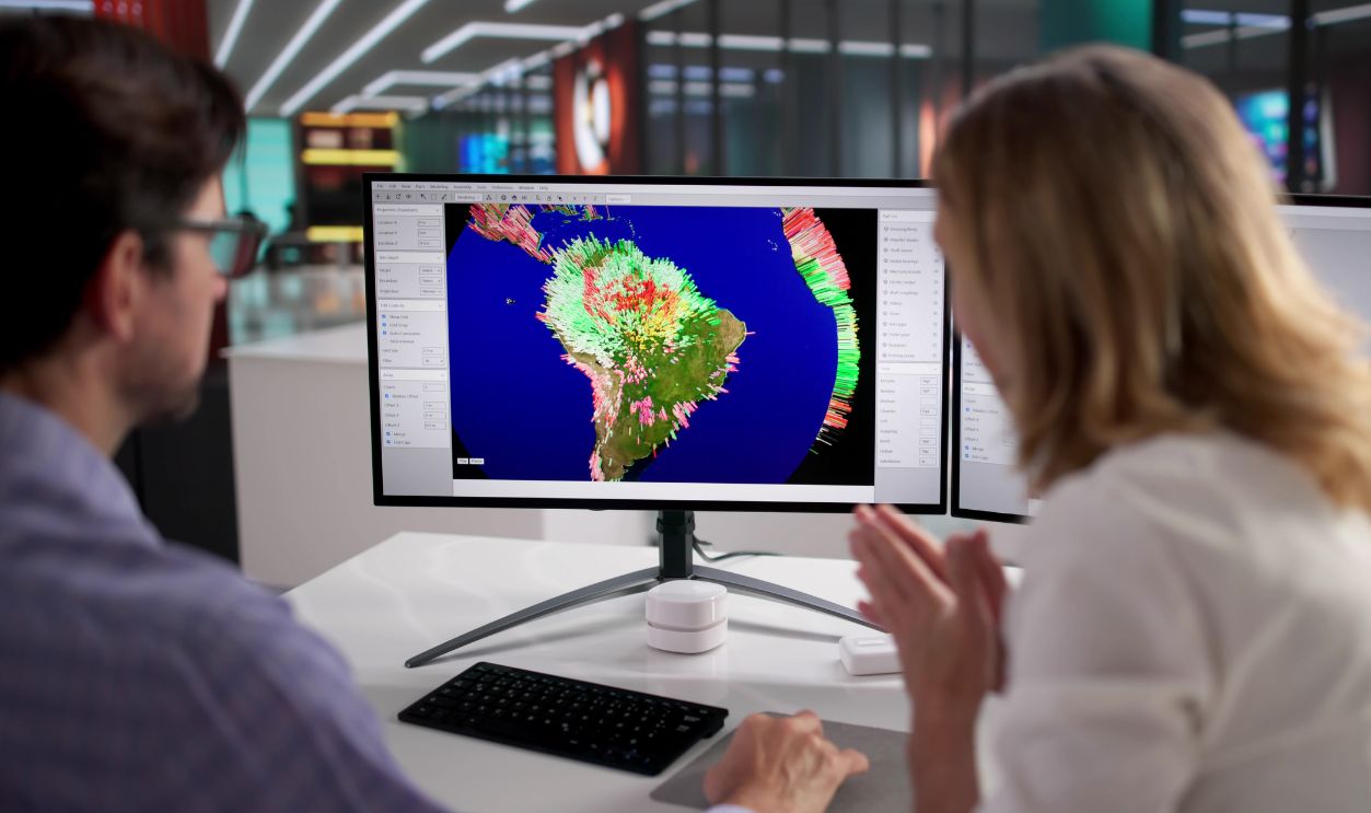 Climate Scientist Studies Global Warming On Computer Screen In Office.