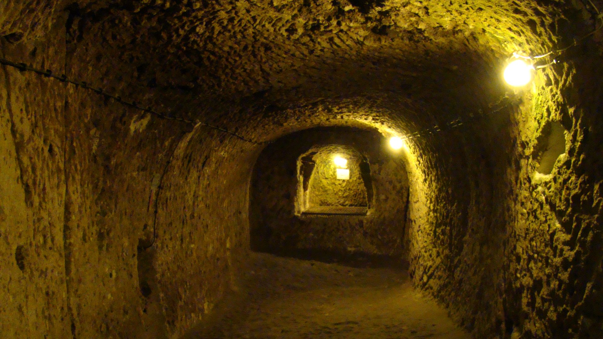 A typical view from inside the underground city in Derinkuyu, one of the largest underground complexes in Cappadocia. There are few artifacts left from the original builders, mainly just large rocks that was used to block the passage for intruders. 
Most 