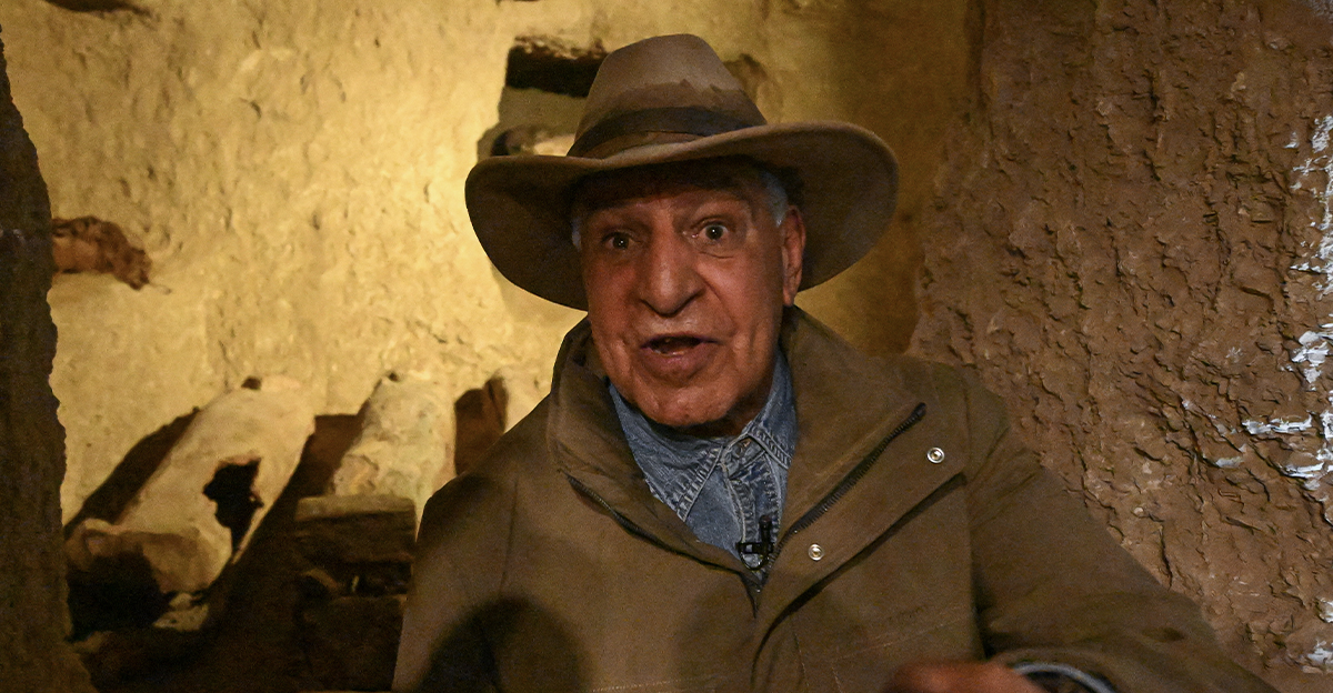 Egyptian archaeologist Zahi Hawass talks to reporters in front of burial shafts and wooden coffins from the 17th dynasty, during a media event to announce new discoveries by the Egyptian archaeological mission he leads at Queen Hatshepsut's Valley Temple in Deir El-Bahari on the Nile's west bank in Luxor on January 8, 2025.