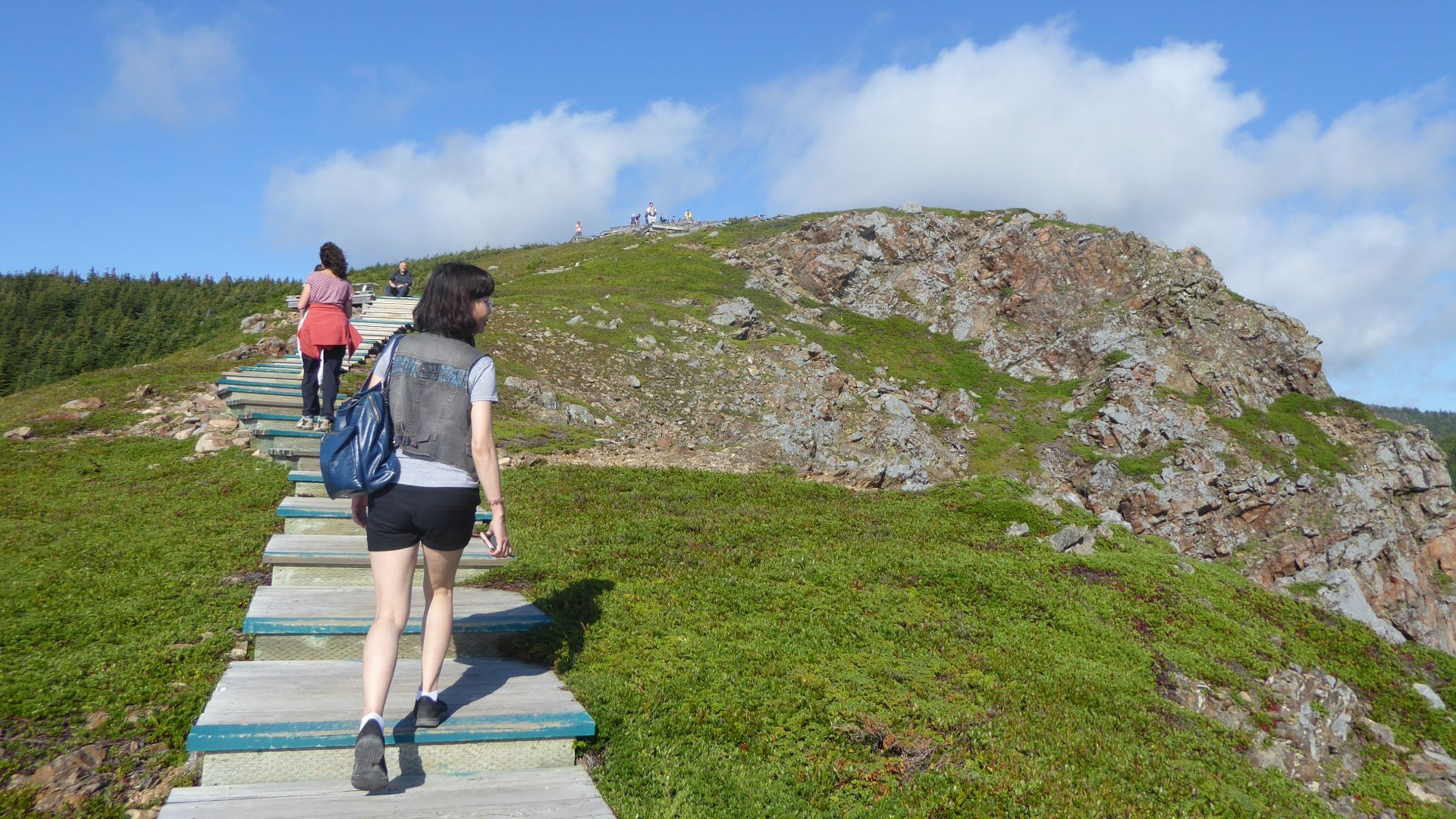 People hiking the Cabot Trail between Pleasant Bay and Petit Étang, in Cape Breton, Nova Scotia, Canada.