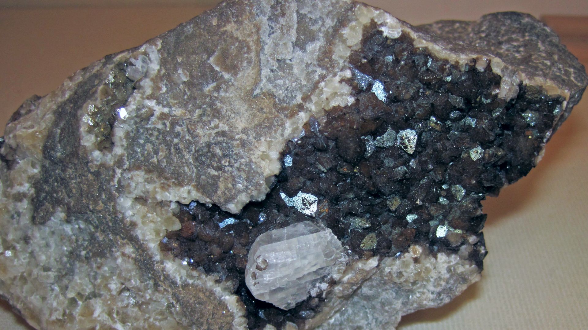 Calcite crystals from Indiana, USA.
A mineral is a naturally-occurring, solid, inorganic, crystalline substance having a fairly definite chemical composition and having fairly definite physical properties.  At its simplest, a mineral is a naturally-occurr