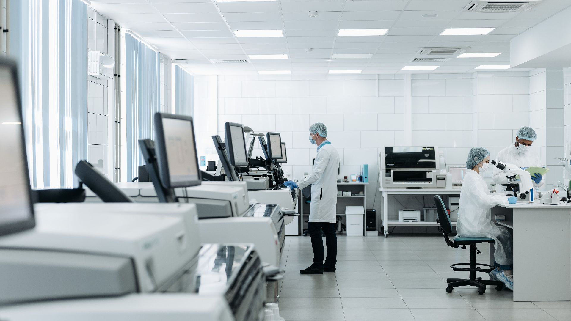 Scientists conducting research in a state-of-the-art laboratory with advanced equipment.