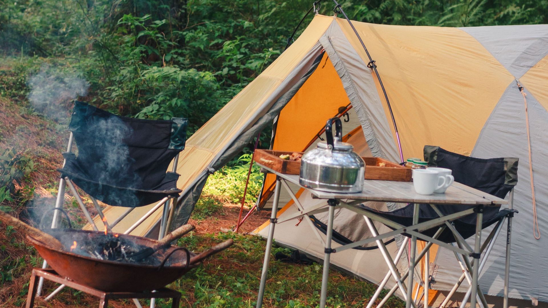 A serene camping scene in a forest with a tent and bonfire. Perfect for outdoor adventure enthusiasts.