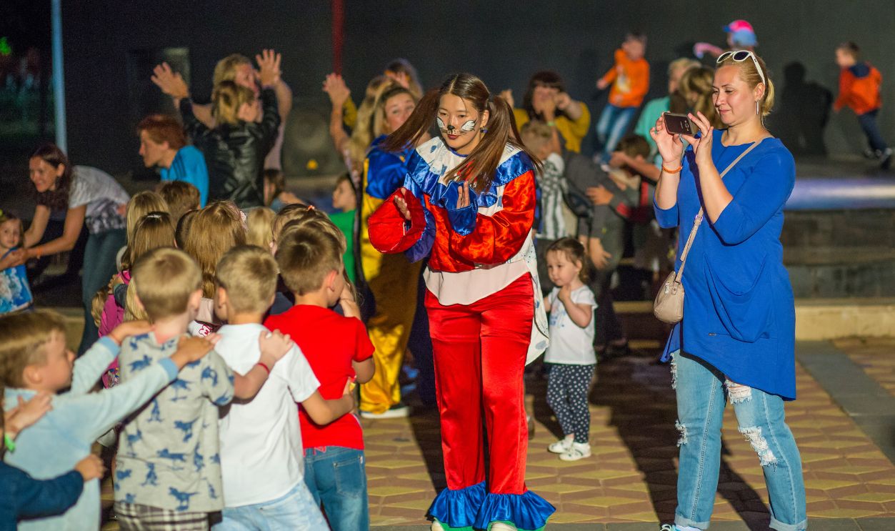 Alanya, Turkey - May, 7, 2017: Children have fun with animators on the evening program. Children's disco in the Turkish resort. Mini disco for children.